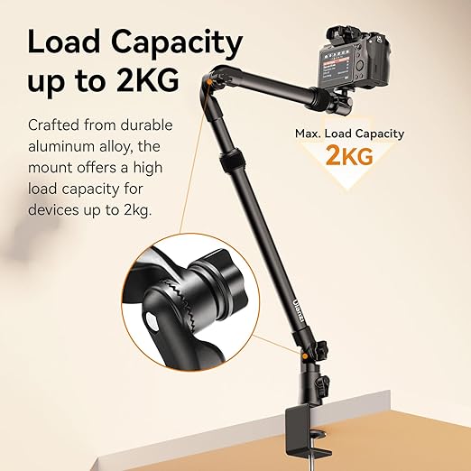 Ulanzi ZJ02 desk mount camera bracket with C-clamp attached to a desk edge, showing the 4-section folding arm extended upwards with its 360-degree ball head.