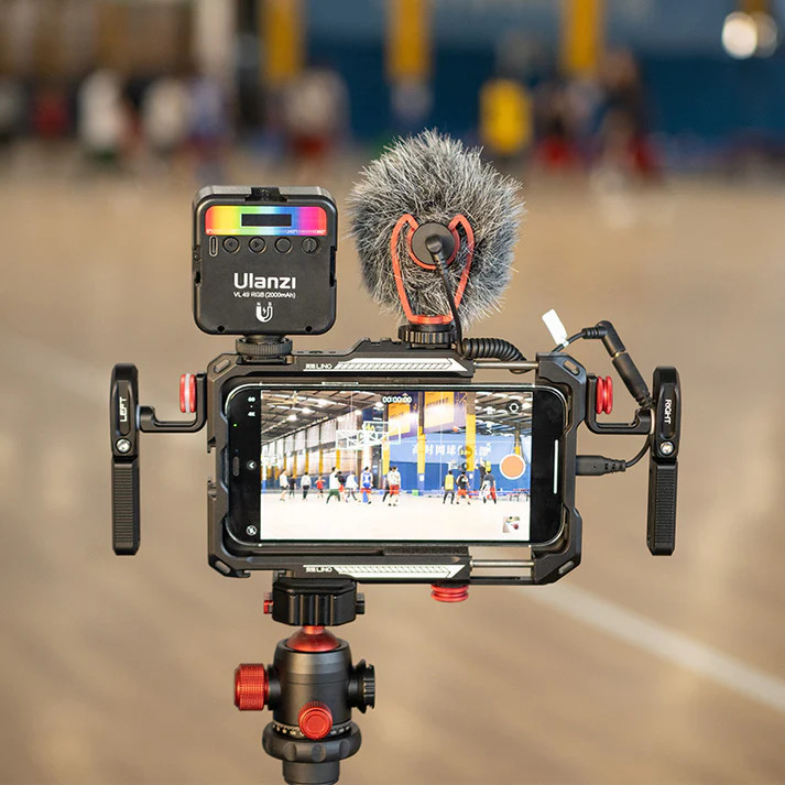 Ulanzi Lino metal cage rig housing an iPhone with an external microphone and LED light attached
