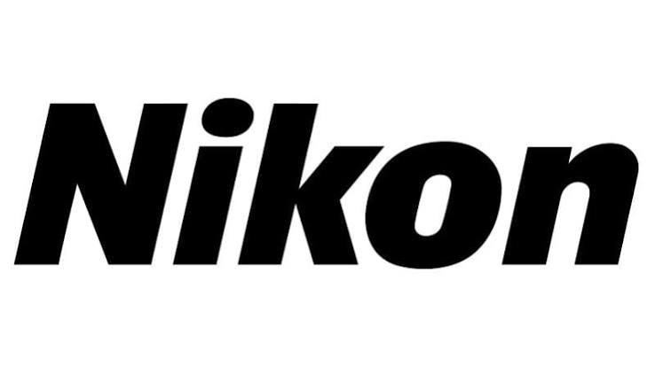 Official yellow and black Nikon brand logo representing Nikon cameras and accessories at Mobile Tech Joint Lagos