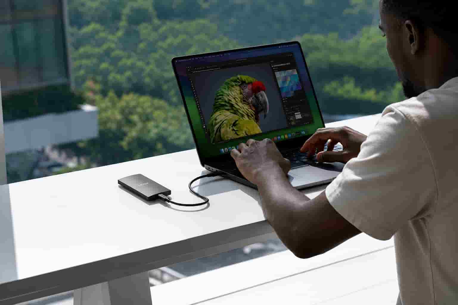 Lexar 2TB SL300 portable SSD connected to a laptop for fast 4K video editing in Lagos.
