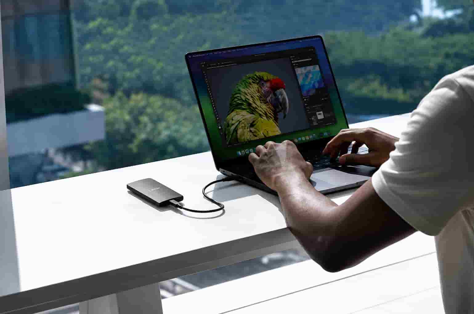 Lexar 2TB SL300 SSD Nigeria portable solid state drive connected to a laptop in Lagos
