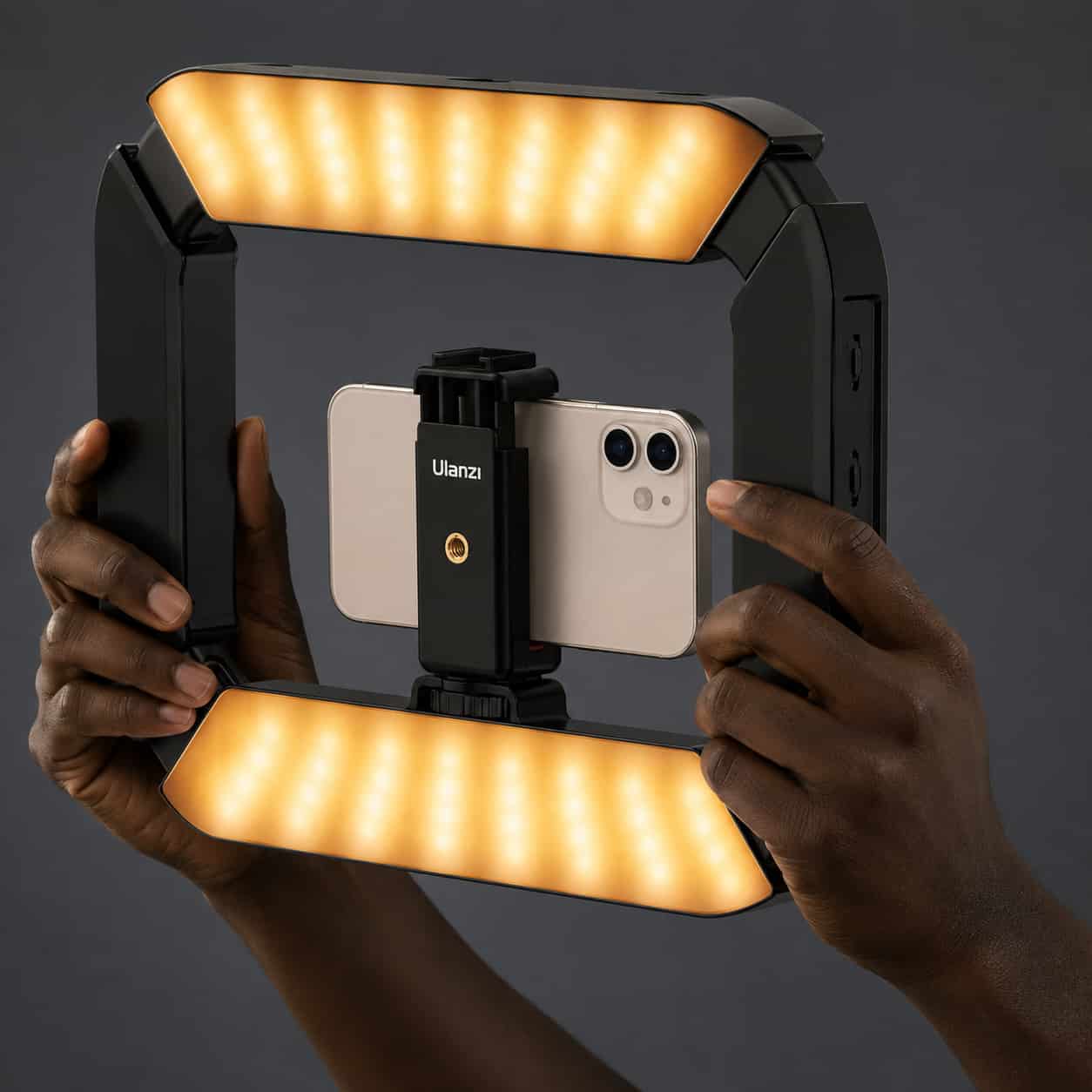 Smartphone mounted inside the Ulanzi U200 Camera Ring Light Video Rig with microphone attached.